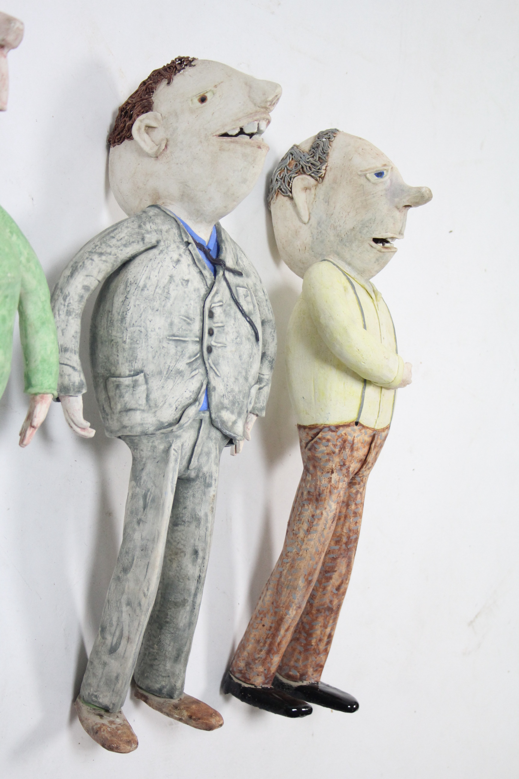 Four American (?) ceramic figural advertising figures, various sizes.