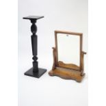 A Victorian walnut rectangular swing toilet mirror on scroll supports, & on serpentine-front