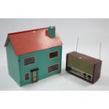 An Ekco transistor radio in mahogany-finish case; & a painted wooden two-storey doll’s house with