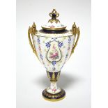 A Royal Crown Derby two-handled ovoid vase & cover painted with vertical strands of flowers in