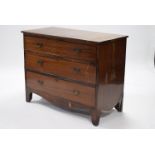 An early 19th century mahogany chest, fitted three long drawers, on bracket feet with shaped