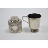 An Edwardian small silver oval teapoy with raised scroll & floral design, 2¾" high, Sheffield