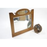 An Edwardian oak-frame overmantel mirror inset two bevelled plates, 36" wide x 34" high; together