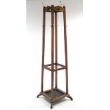 An Edwardian oak standing four-division hat & coat stand of square tapered form, 73" high.