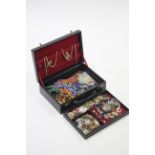 A quantity of various costume jewellery, etc., contained in a black leather jewellery case.