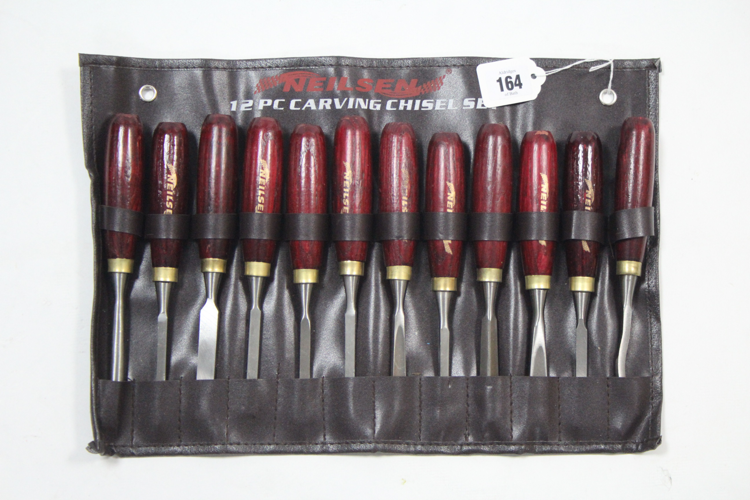 A Neilsen twelve-piece carving chisel set.