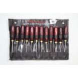 A Neilsen twelve-piece carving chisel set.