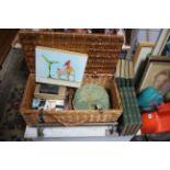 A wicker hamper (lacking contents), 23" wide; together with four decorative pictures, various books,