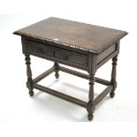 An 18th century continental-style carved mahogany occasional table with rectangular top, fitted