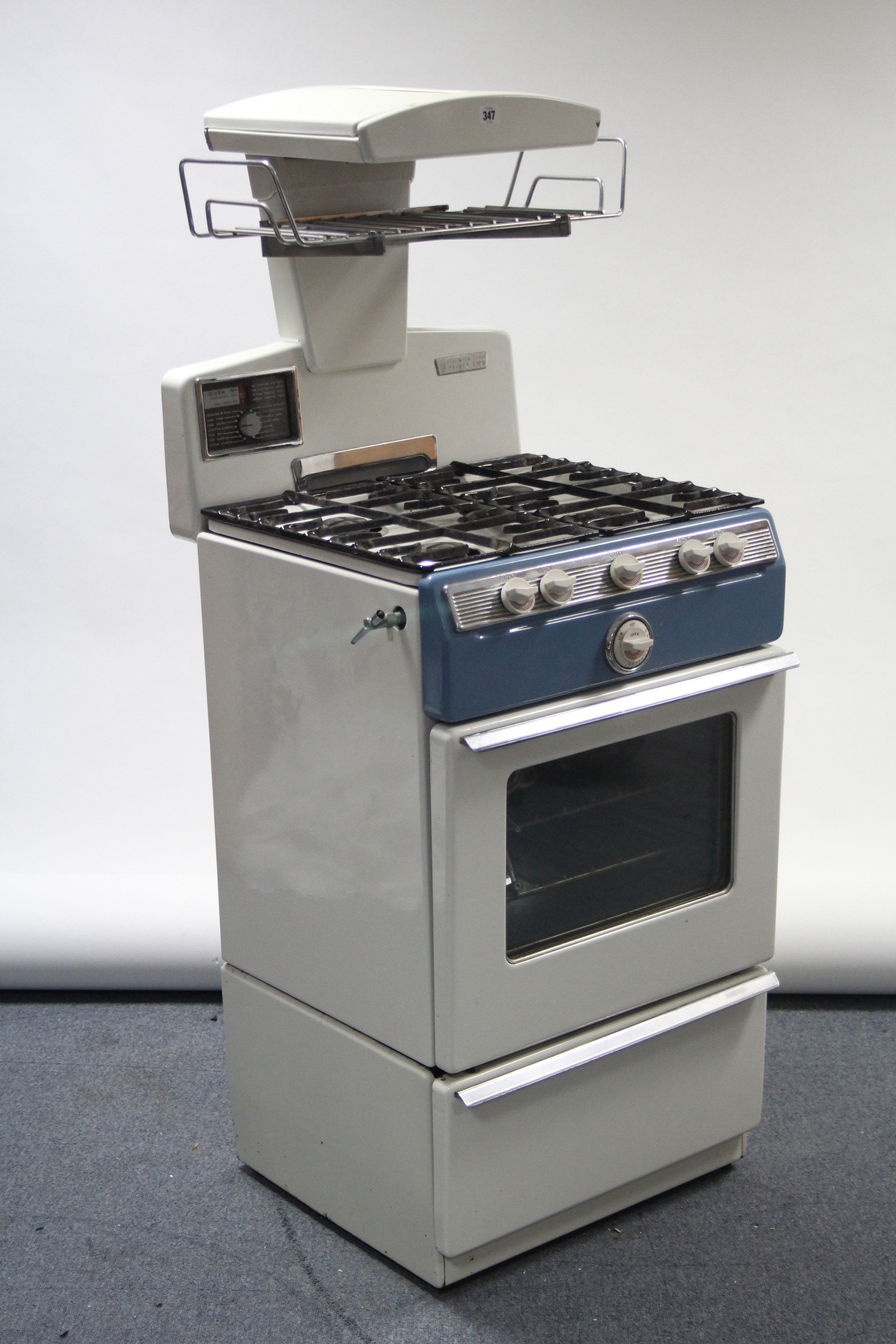 A 1960’s Parkinson Cowan “Prince Two” gas cooker in white & blue finish case.