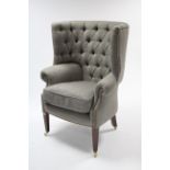 A 19th century-style buttoned-back tub-shaped armchair upholstered brass-studded grey & white