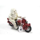 A modern painted cast-iron Michelin Man on Motorbike advertising figure, 6½” high.