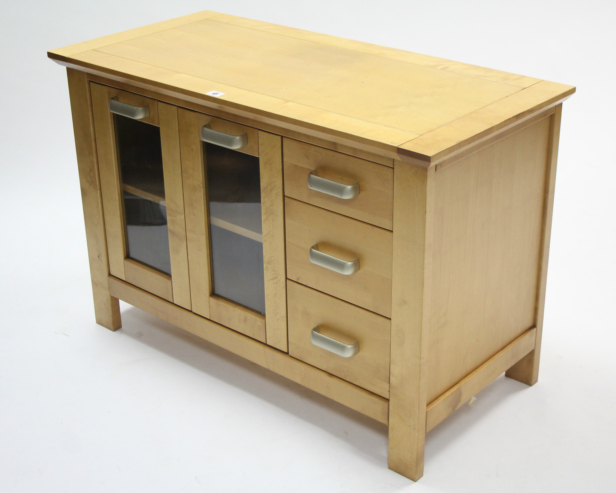 A maple-finish dwarf side cabinet, fitted centre shelf to the left-hand side & centre enclosed by