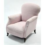 A late Victorian armchair upholstered pale pink material, & on short turned legs with steel