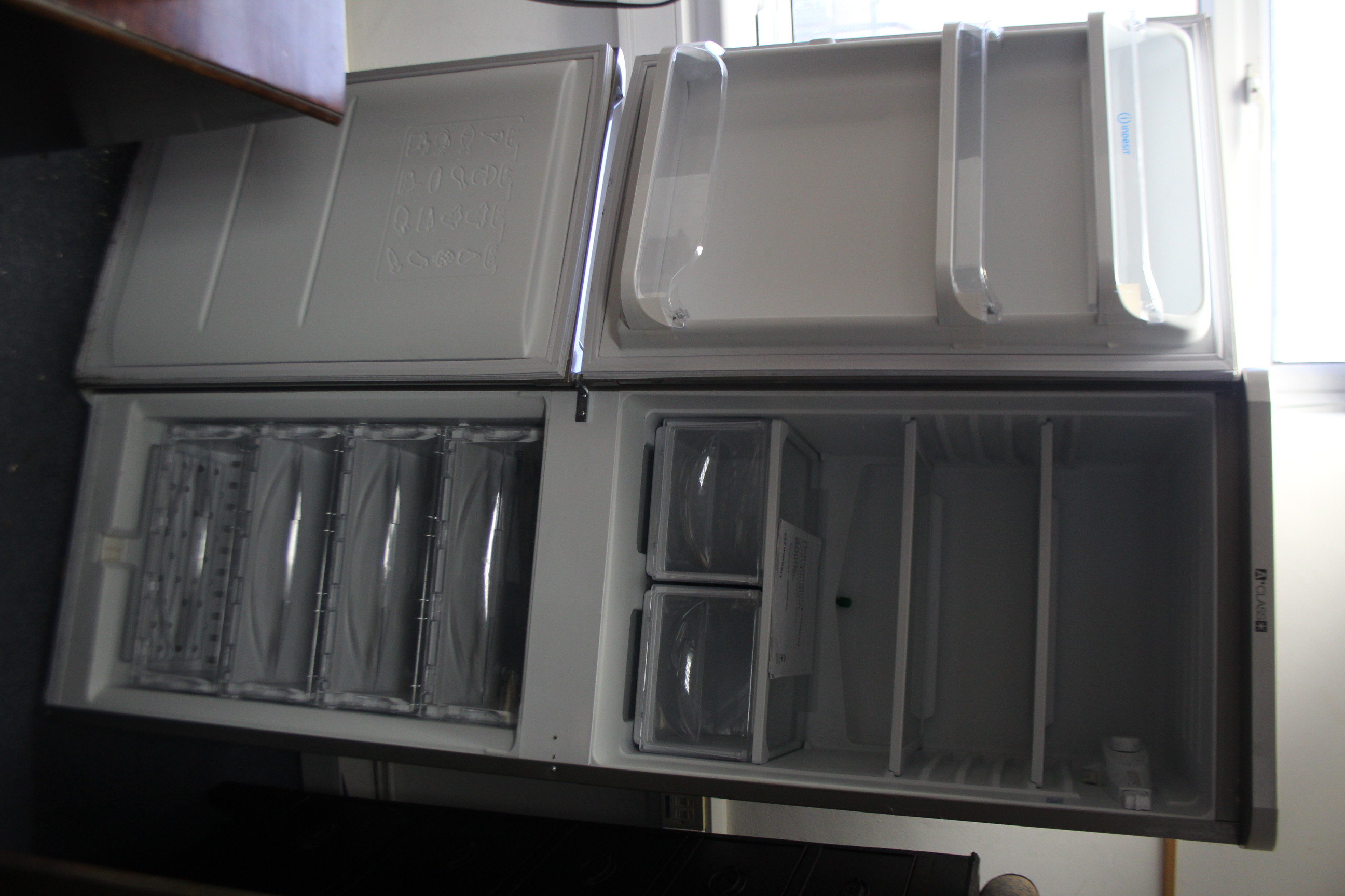 An Indesit A-class upright fridge-freezer in silvered-finish case, w.o. - Image 2 of 2