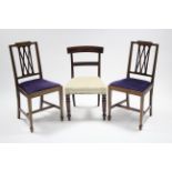 A pair of Sheraton-style mahogany occasional chairs with carved & pierced lattice backs, padded