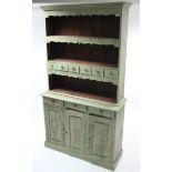 A green painted/distressed hardwood dresser, the upper part fitted two open shelves, the lower shelf