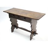 An 18th century-style oak side table with rectangular top, fitted two frieze drawers with moulded