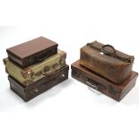 A leather suitcase fitted brass twin-lever locks, 24" wide; a leather Gladstone-type holdall; &
