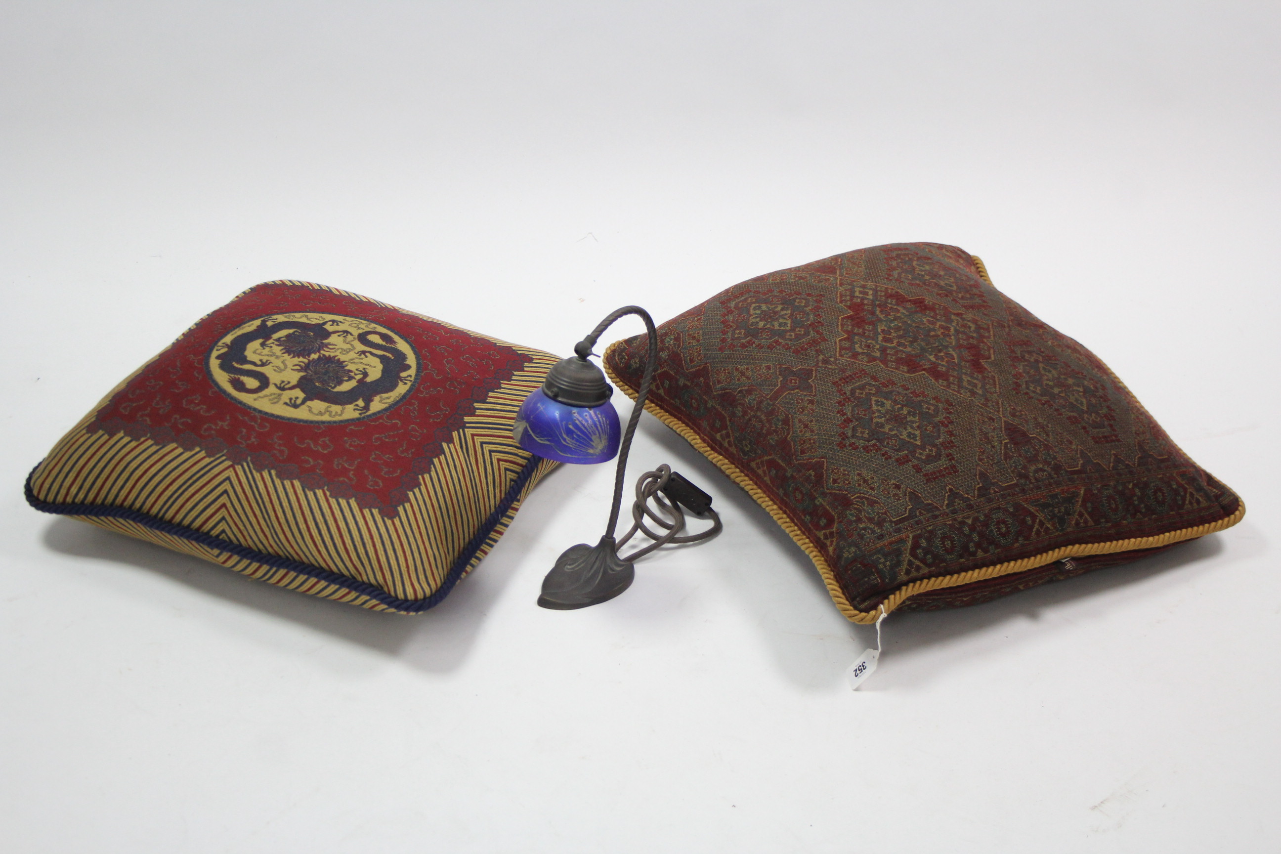 Two mulberry embroidered scatter cushions; & an Edwardian-style desk lamp.