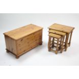 A pine nest of three rectangular occasional tables; & a pine blanket box, 32" wide.