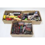 Approximately one hundred various scale model trains, cars, lorries, etc., all un-boxed.