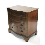 A mahogany serpentine-front chest fitted four long graduated drawers with brass swing handles, &