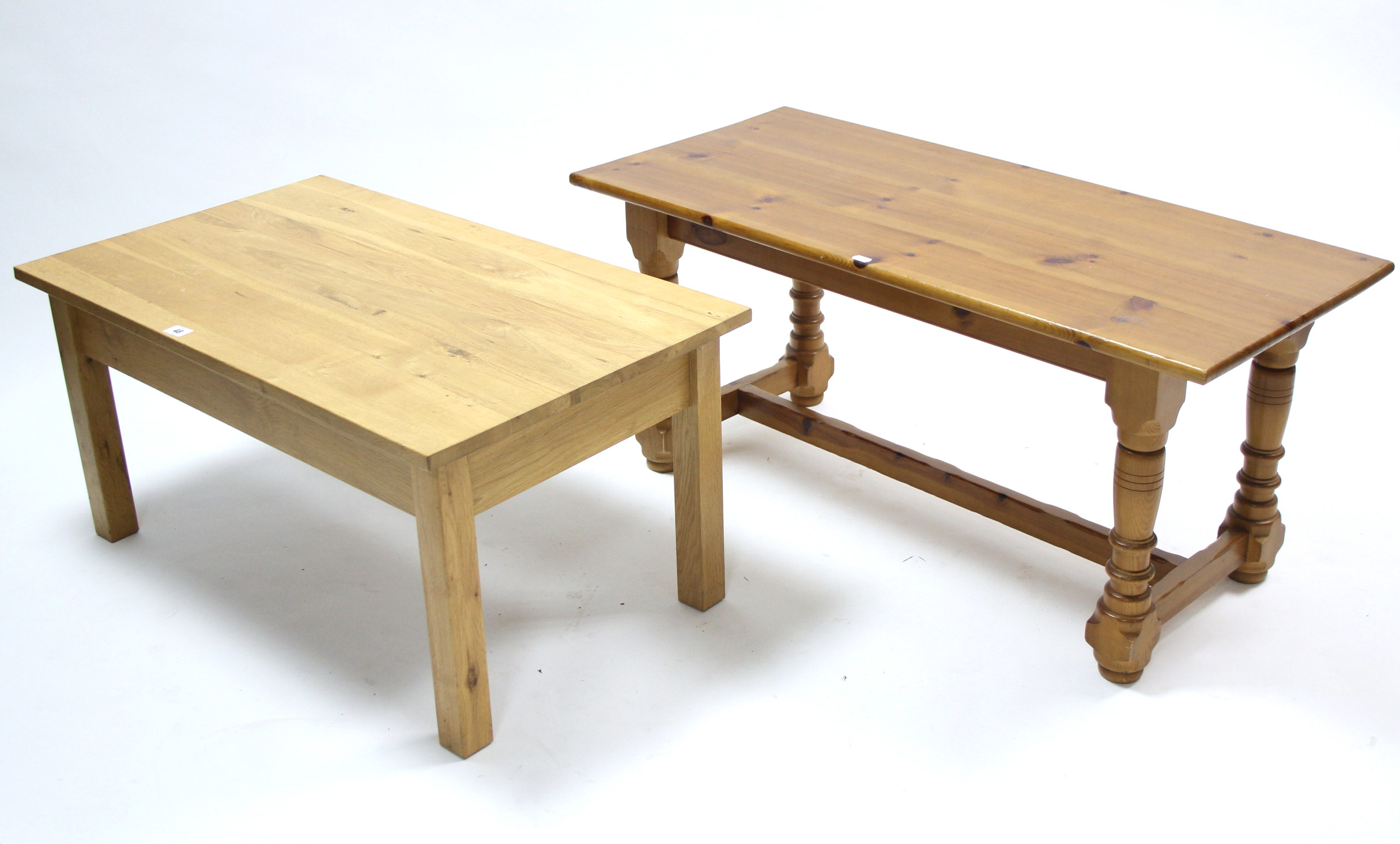 A light oak-finish rectangular low coffee table on square legs, 33¾" wide; & a similar pine ditto,