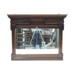 A late 19th/early 20th century mahogany overmantel mirror with dentil frieze & with roundels to