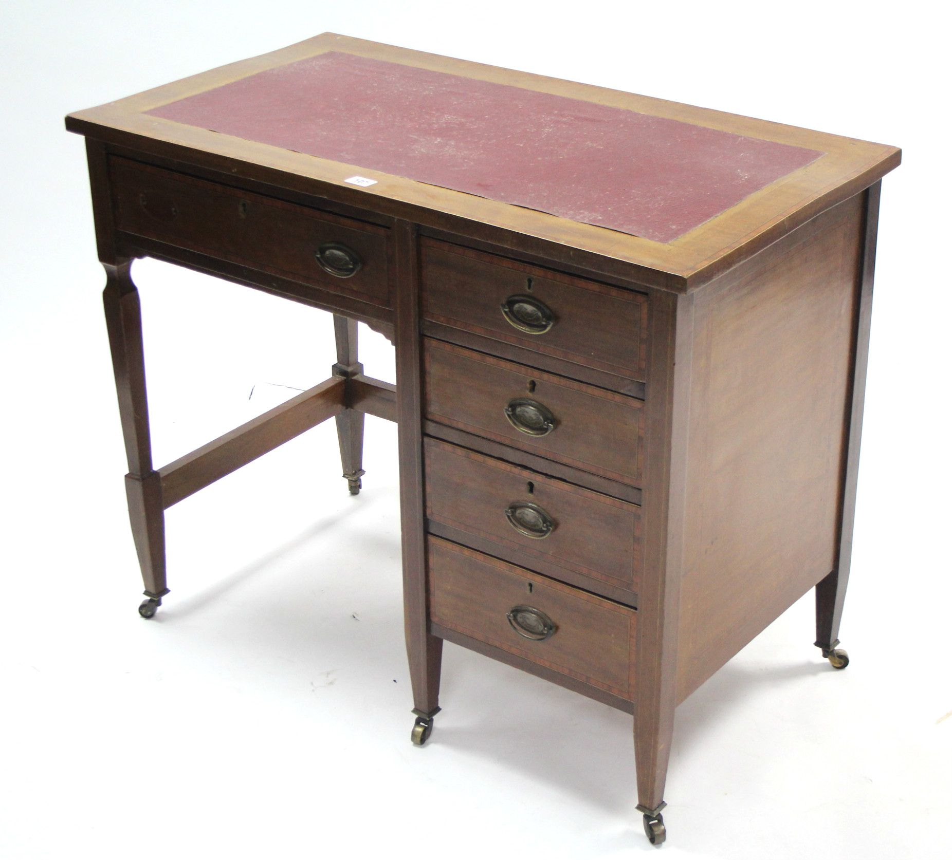 An Edwardian inlaid-mahogany small desk inset crimson leatherette to the rectangular top, fitted