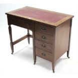 An Edwardian inlaid-mahogany small desk inset crimson leatherette to the rectangular top, fitted