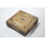 A steel-bound wooden butcher's block, 17¾" square x 5" high.