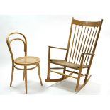 A Danish beech spindle-back rocking chair by Mobler with woven string seat; & a Bentwood café chair.