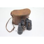 A pair of Atlas 7 x 50mm field glasses (no. 24559), with leather case; together with a pair of