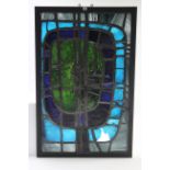 A Roy Lewis leaded stained glass panel of stylised geometric design (slight faults), 50¾” x 32¾”,