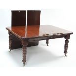 A late Victorian mahogany extending dining table with rounded corners & moulded edge to the