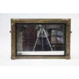 A 19th century carved giltwood frame overmantel mirror with ebonised inner slip, 38” x 25½”.