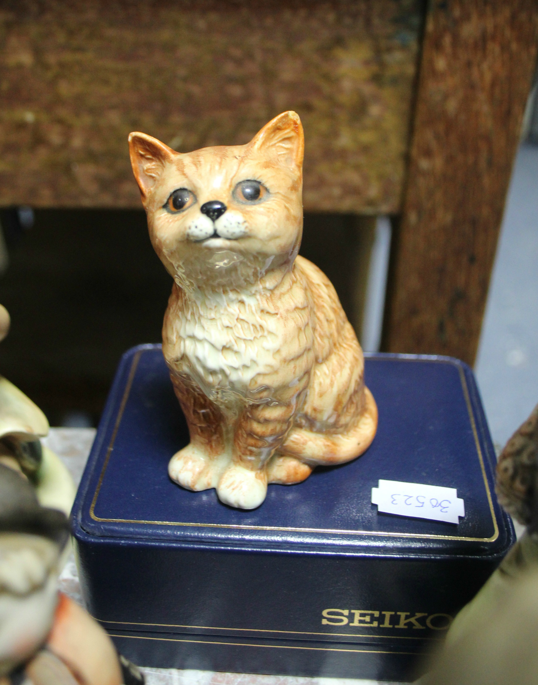 A Beswick character cat ornament (No. 1886); various Hummel-style figures; an oriental vase, etc.,