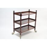 A Victorian mahogany rectangular three-tier dinner wagon on ring-turned supports & brass castors,