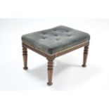 A Victorian walnut stool upholstered pale blue buttoned velour, & on turned tapered legs, 24" wide.