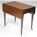 An early 19th century mahogany Pembroke table with boxwood & ebony inlay, fitted single drawer