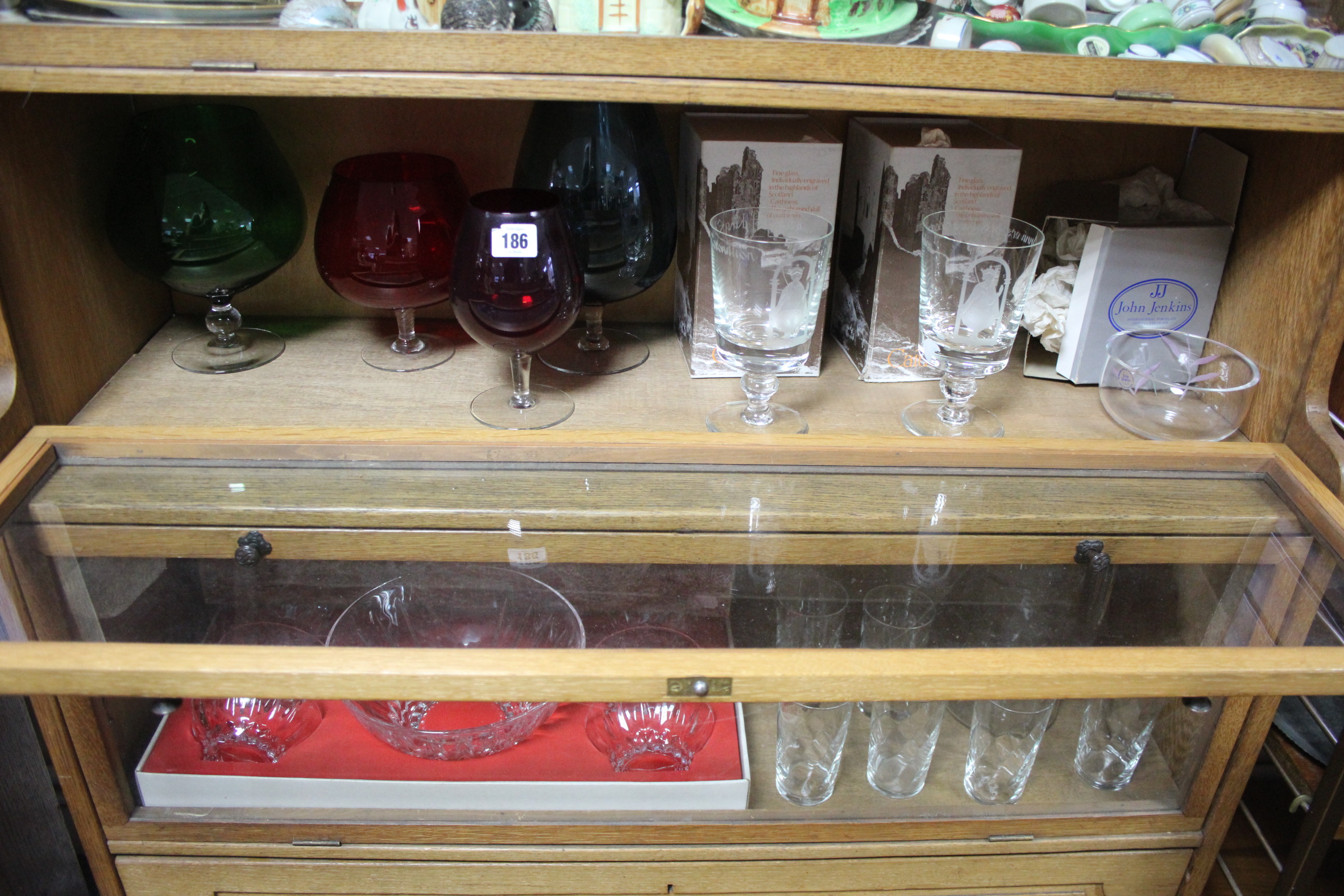 Two Caithness etched glasses; a Cristal d'Arques seven-piece service, all boxed; three glass