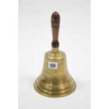 A modern brass hand bell with carved treen handle, 10¾" high.