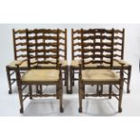 A set of six oak ladder-back dining chairs (including a pair of carvers) with rush seats, & on