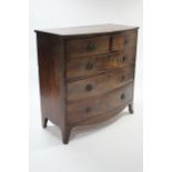 A 19th CENTURY MAHOGANY BOW-FRONT CHEST fitted two short & three long graduated drawers with brass