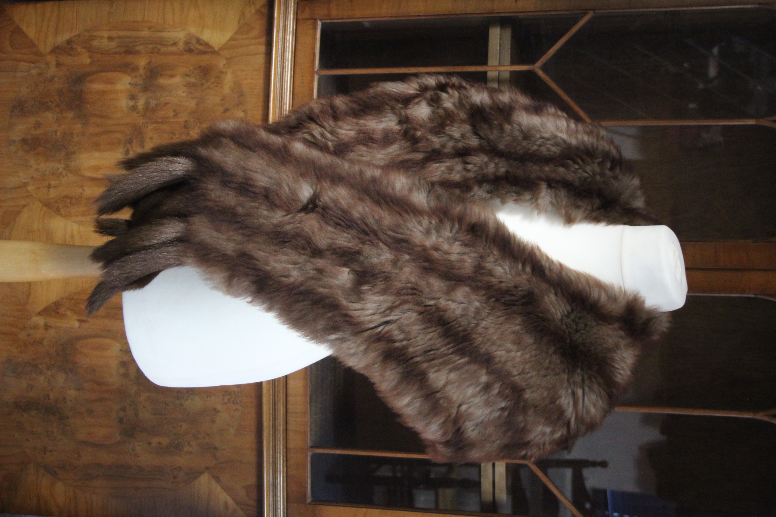 A Debella silk-lined fur shawl.