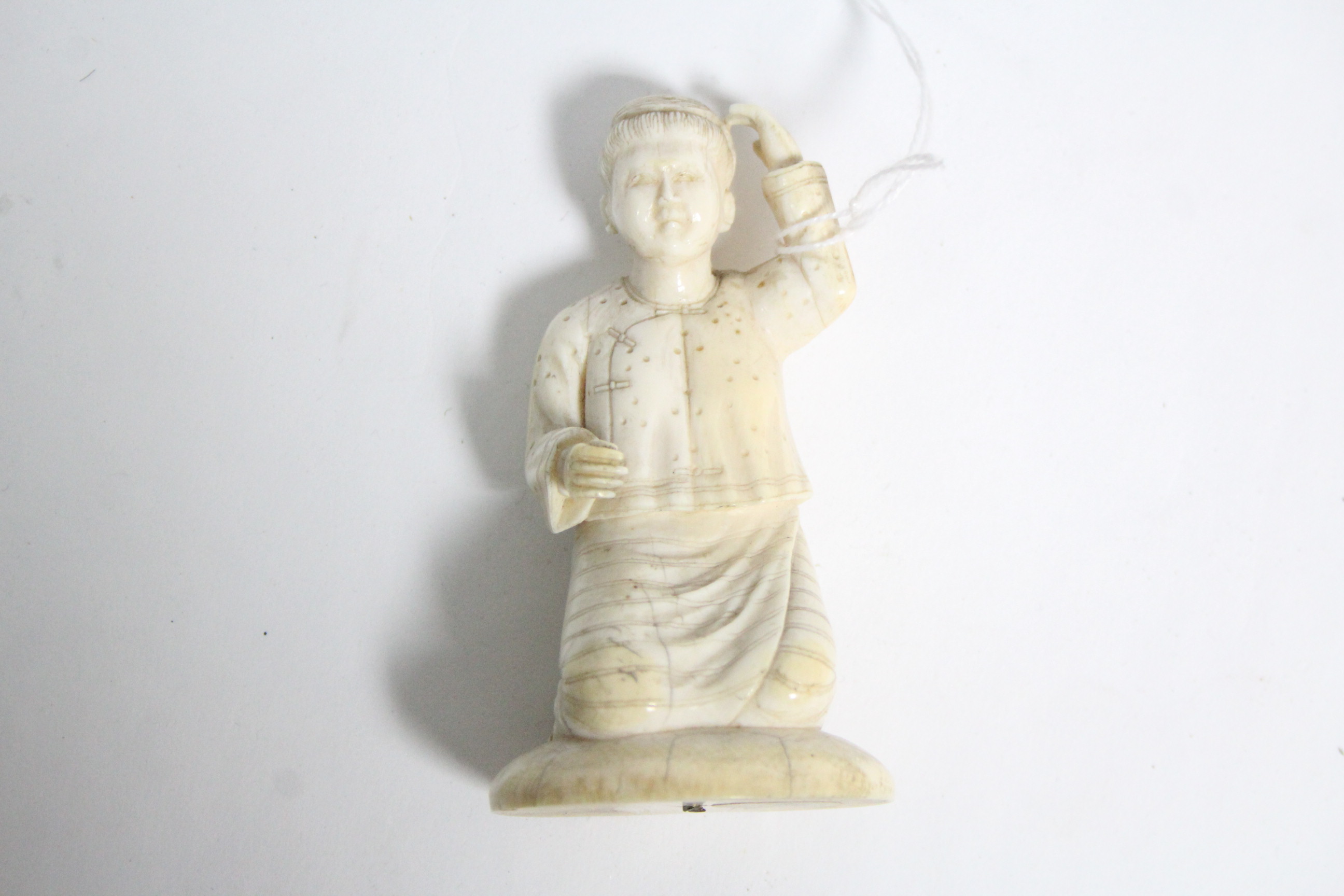 An oriental carved ivory kneeling figure of a woman, 3½” high; a Japanese ivory circular box with - Image 5 of 7