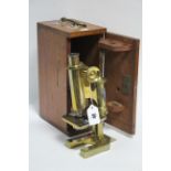 A BRASS MONOCULAR MICROSCOPE by R & J BECK OF LONDON (No. 29431), in fitted mahogany case.