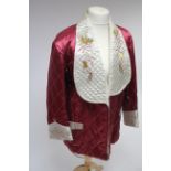 A Chinese-style crimson & ivory satin housecoat with embroidered dragon design.