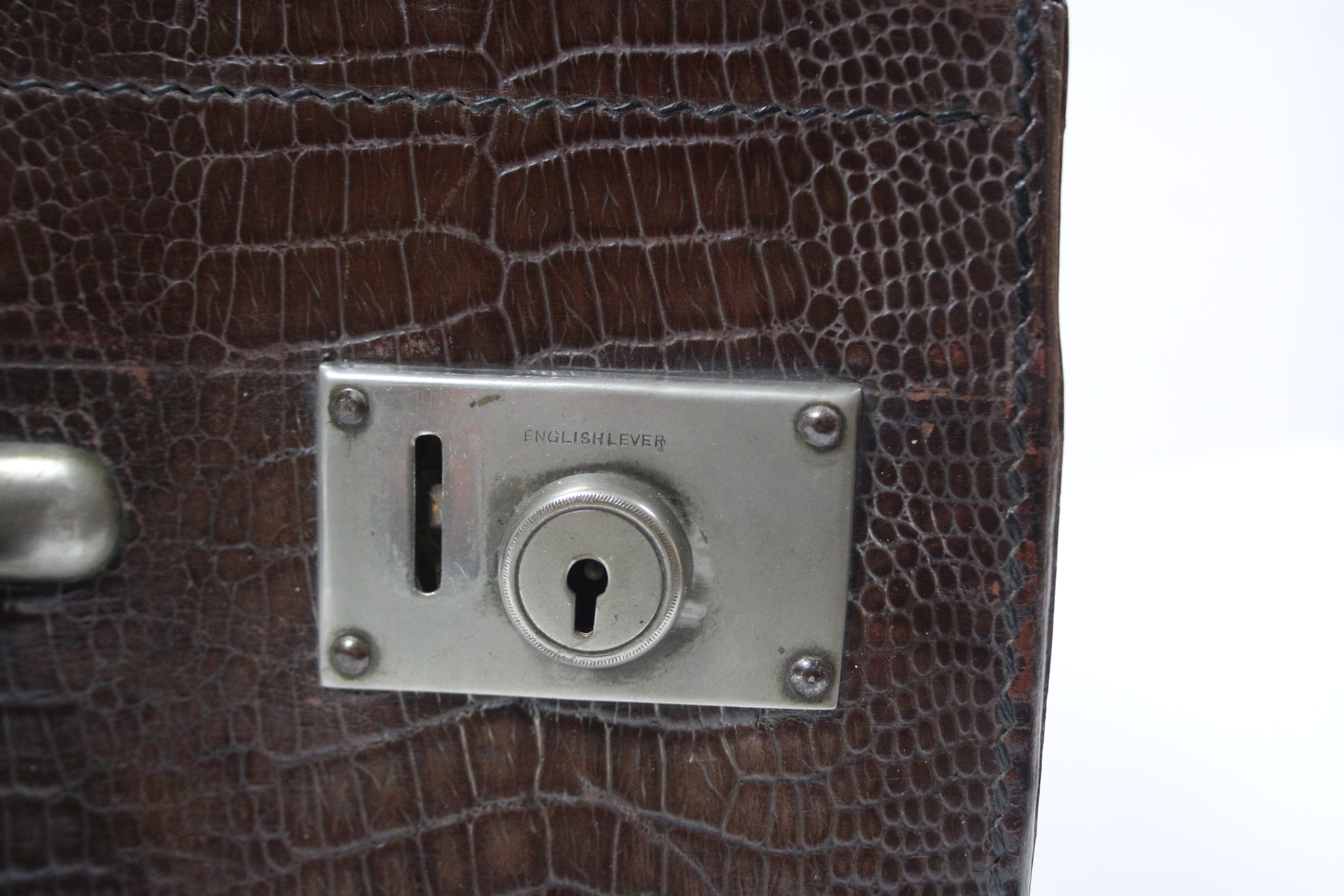 An early 20th century simulated crocodile skin leather travelling case with chrome twin-lever locks, - Image 4 of 4